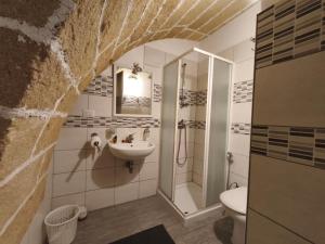 a bathroom with a sink and a shower and a toilet at Angolo del corso in Gallipoli
