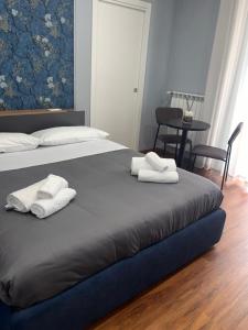 Postel nebo postele na pokoji v ubytování B&B MariLù