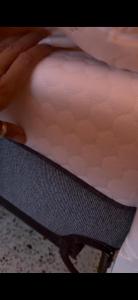 a close up of a person laying on a bed at La Clementina in San Clemente del Tuyú