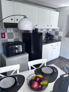 A kitchen or kitchenette at Cozy studio apartment in the heart of Athens