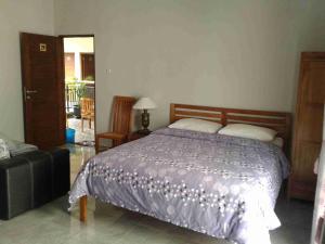 Voodi või voodid majutusasutuse Aloha Hotel Yogyakarta toas