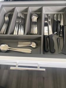 a drawer filled with utensils and utensils at Almondbank Cottage 8 miles from Portree 2 bedrooms sleeps 3 adults in Skeabost +10 photos