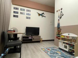 TV o dispositivi per l'intrattenimento presso 洄游民宿 Migration B&B
