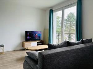 TV a/nebo společenská místnost v ubytování Happy Day-Appartement entier 2 chambres-60 m2