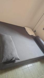 a mattress laying on the floor in a room at Le house hostel in São Paulo