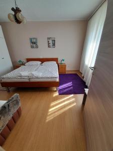 Postel nebo postele na pokoji v ubytování Apartman Peric