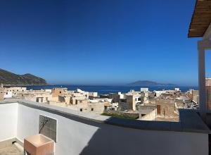 a view of a group of buildings and the ocean at Favignana Holidays 4 in Favignana