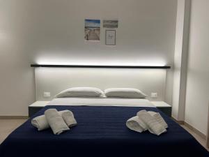 Postel nebo postele na pokoji v ubytování Perla D'Oriente - Affittacamere