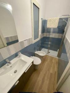 a bathroom with a sink and a toilet and a shower at Villa Saint George in Scopello +33 photos
