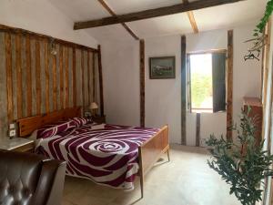 a bedroom with a bed and a window in it at Cabaña rural piscina privada in Orihuela