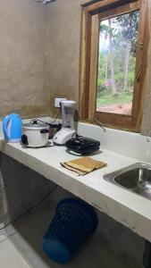 a kitchen counter with a blender and a sink at RURAL CLAY HOUSE Hiriketiya in Hiriketiya