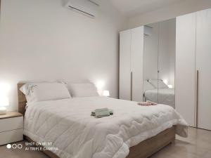 Postel nebo postele na pokoji v ubytování Sun Sea House Agrigento + 5 fotografií