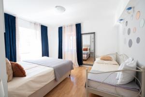 Postel nebo postele na pokoji v ubytování Guesthouse Rebecca