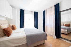 Postel nebo postele na pokoji v ubytování Guesthouse Rebecca
