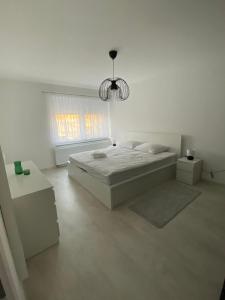 Ένα ή περισσότερα κρεβάτια σε δωμάτιο στο Apartman Centar