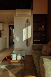 a living room with a couch and a coffee table at Venti Beach Houses in Zandvoort