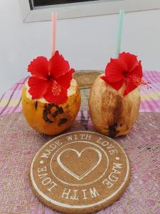 three coconuts with a sign that says please miss the love on halim at White Jaguar House in Bwejuu +13 photos