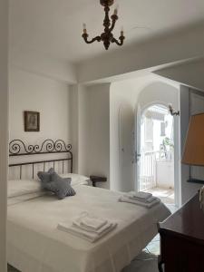 En eller flere senge i et værelse på La Casa di Audrey