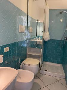 a bathroom with a toilet and a sink and a shower at La Casa di Audrey in Capri