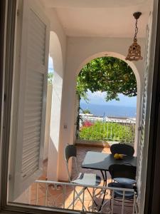 En balkon eller terrasse på La Casa di Audrey
