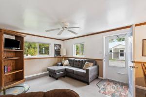 a living room with a couch and a ceiling fan at Cottages 7 & 9 - Fire Pit - Beach - Sleeps 8 in Lincoln Junction