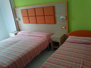 Postel nebo postele na pokoji v ubytování Hotel Consul