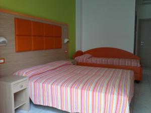 Postel nebo postele na pokoji v ubytování Hotel Consul