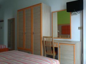 Postel nebo postele na pokoji v ubytování Hotel Consul