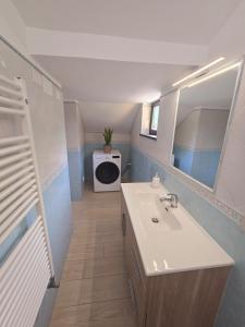 a bathroom with a sink and a mirror at The house in the green in Piano di Sorrento