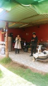 a couple of people standing in a room at Casa Mirador en la ciudad Inca Cusco in Cusco