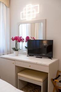 TV a/nebo společenská místnost v ubytování Park Hotel Villa Giustinian