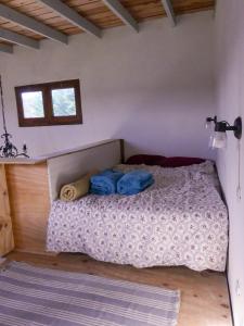 Voodi või voodid majutusasutuse Tiny House en Playa Dorada toas