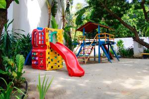 a playground with a red slide at Casa Pipa Atlantico in Pipa