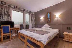Letto o letti in una camera di Hotel Ad'Eldorado