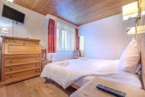 Letto o letti in una camera di Hotel Ad'Eldorado