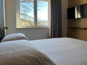Voodi või voodid majutusasutuse SambuRoom B&B toas