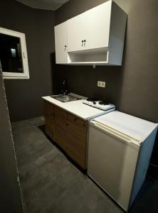 a kitchen with a sink and a dishwasher at The Pera Hotel Marmaris in Marmaris +42 photos