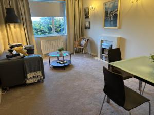 a living room with a couch and a table at Stylish Dublin4 - One Bedroom Apt in Dublin
