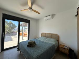 a bedroom with a bed with a toy truck on it at Villa SAMBA in Kamilari +63 photos