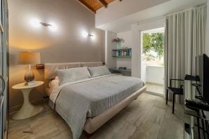 Postel nebo postele na pokoji v ubytování Hotel Boutique Casa Mar