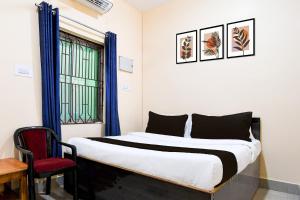 Ένα ή περισσότερα κρεβάτια σε δωμάτιο στο Super Hotel O Sai Lagoon