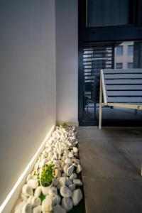 a row of rocks on the floor next to a bench at Accommodation for 4 people in Valencia