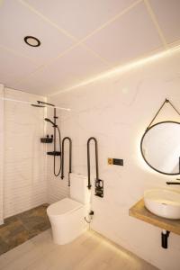 a bathroom with a sink and a toilet and a mirror at Accommodation for 4 people in Valencia +10 photos