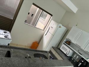 Kuchyň nebo kuchyňský kout v ubytování Apartamento com garagem coberta