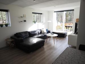 Zona de estar de Skovgårdens Apartment