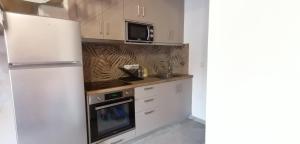 Kuchyň nebo kuchyňský kout v ubytování Aenaon Corfu Apartments #06 + 14 fotografií