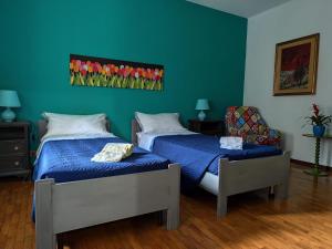 Postel nebo postele na pokoji v ubytování La Caliera 5 Casa Vacanze