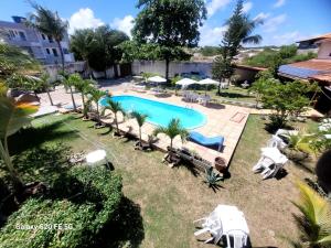 an image of a swimming pool at a resort at Pousada da Mércia - Itapuã (BA) in Salvador