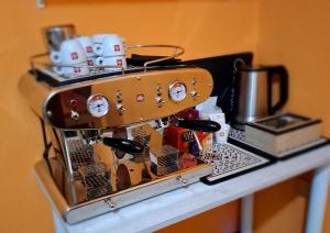 a wine rack with bottles and a suitcase on a counter at B&B La casa di Dorothy in Telti