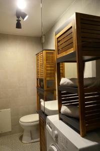 a bathroom with a bunk bed and a washing machine at Guesthouse Evilia in Poros +47 photos